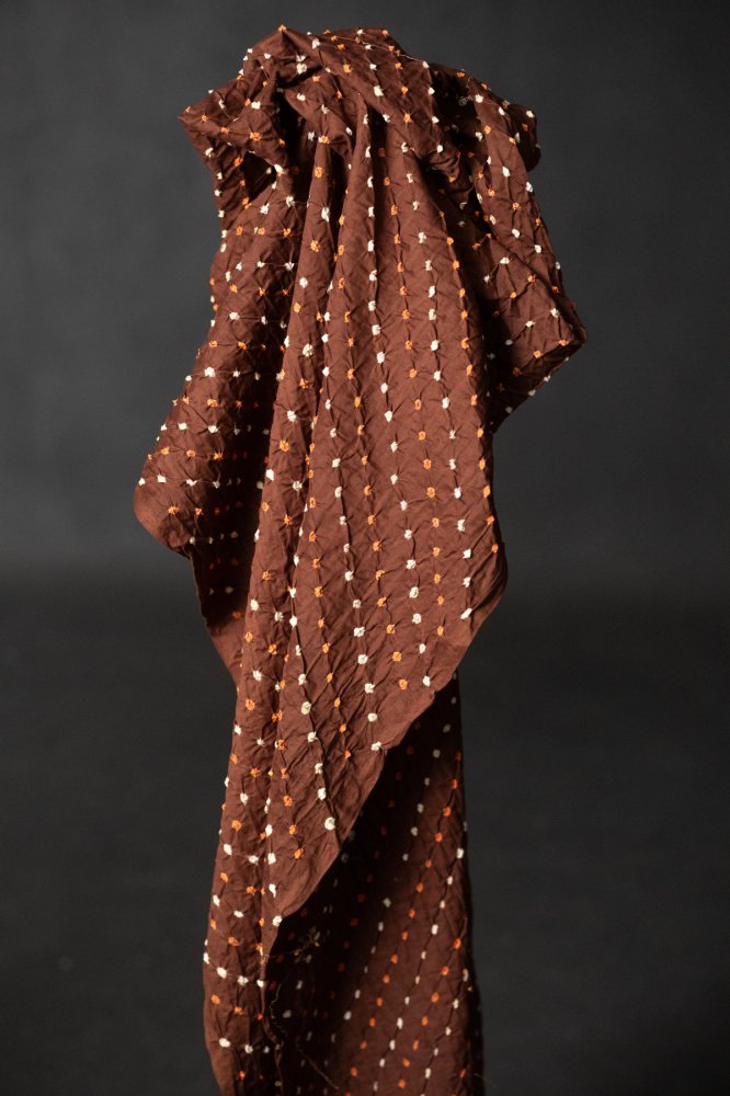 Bandhani tie-dye Indian cotton fabric in rust brown
