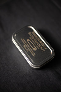 sewing kit in metal tin